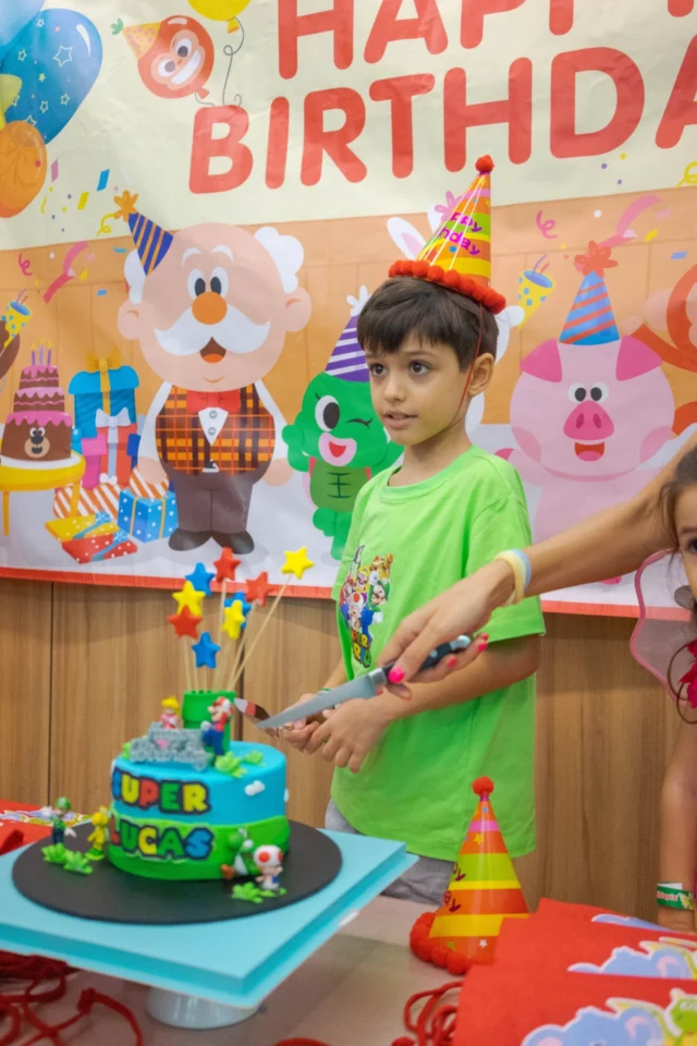 Boy Cutting Birthday Cake